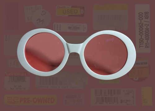 Round retro sunglasses with red lenses and white frame on a background of used books and papers