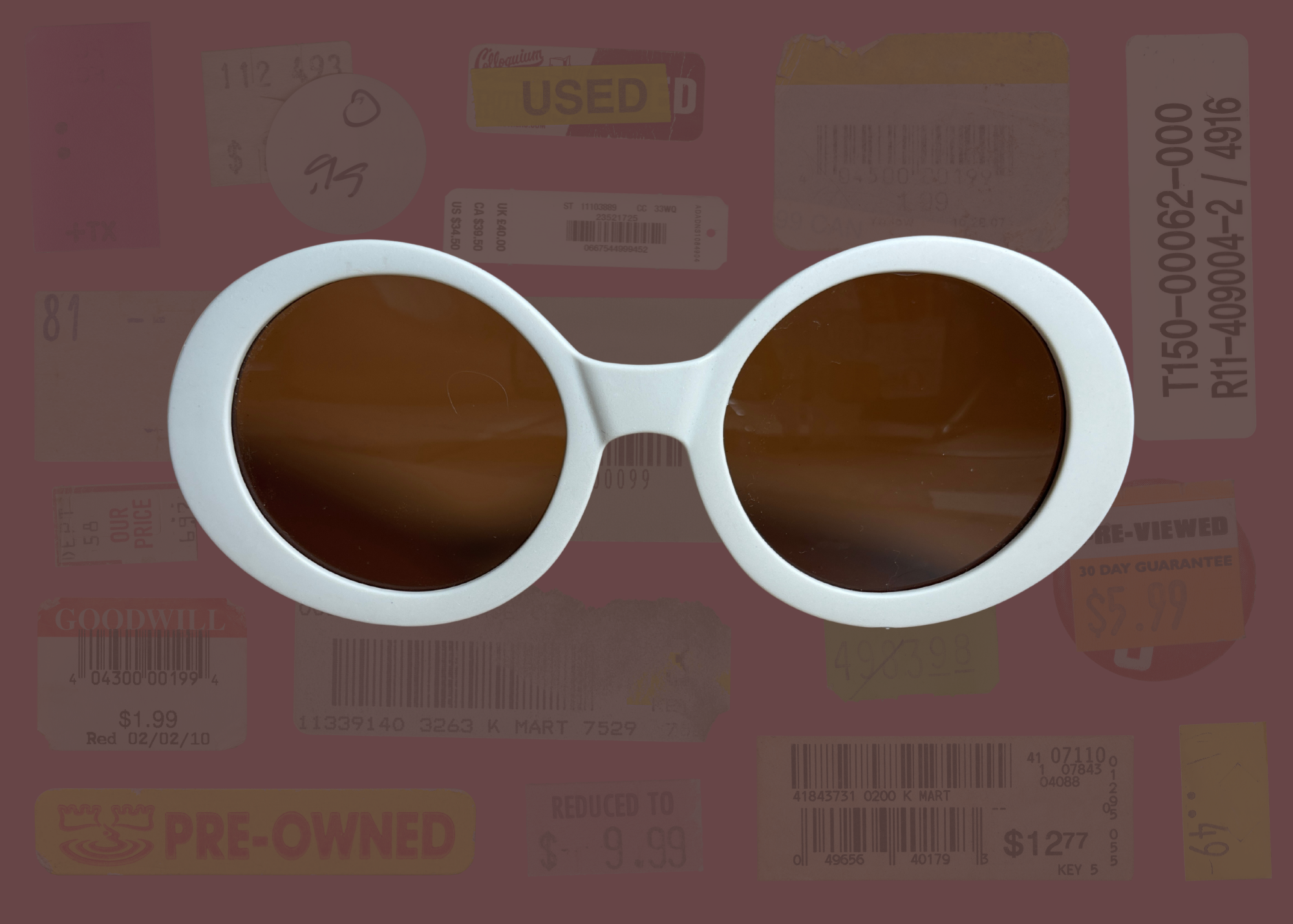 White round sunglasses with brown lenses on a background of used receipts